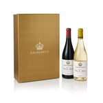 Highgrove wine gift set featuring a gold presentation box, a bottle of red wine, and a bottle of white wine on a clean white background.