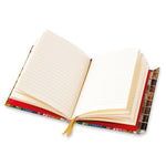Open notebook with decorative cover on a white background