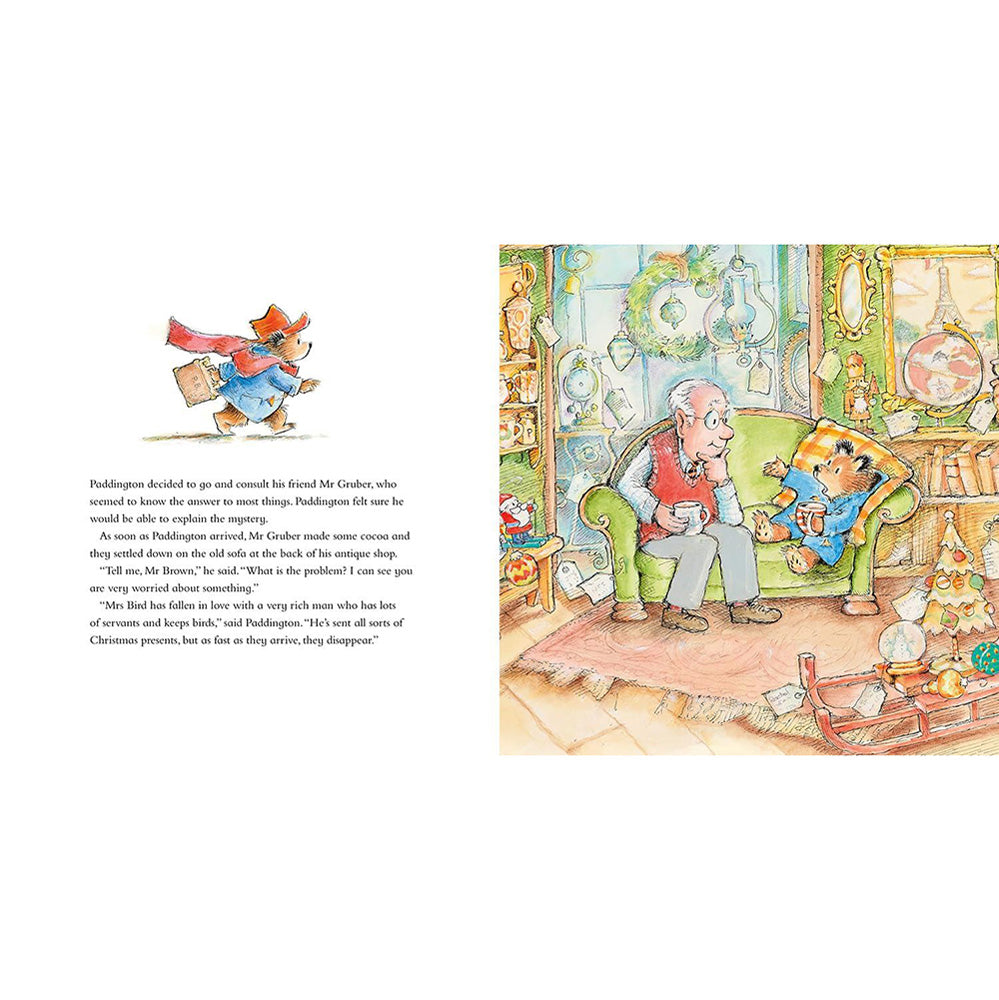A two-page spread from a children's book showing an illustrated scene of an old man sitting on a green armchair in a cluttered shop, with a small red bird in a red hat perched on the open book at the top left. The left page contains a block of text, and the right page contains the illustration.