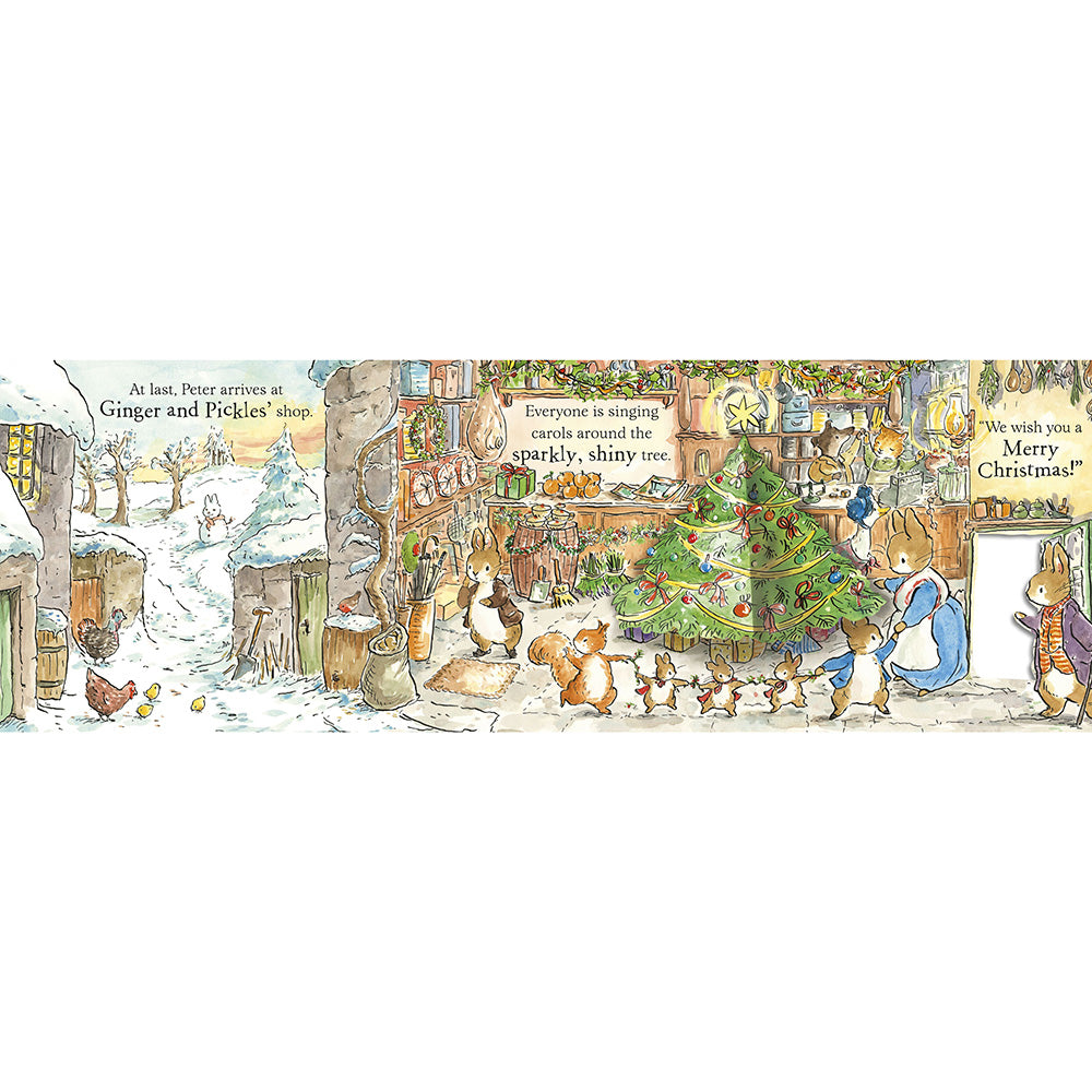 A wide illustrated scene showing a snowy winter village with animals gathered around a decorated Christmas tree. The artwork includes text such as 'At last, Peter arrives at Ginger and Feddie's shop' and 'We wish you a Merry Christmas!' This appears to be the product itself rather than a lifestyle photo, so subject_type is Scenery.
