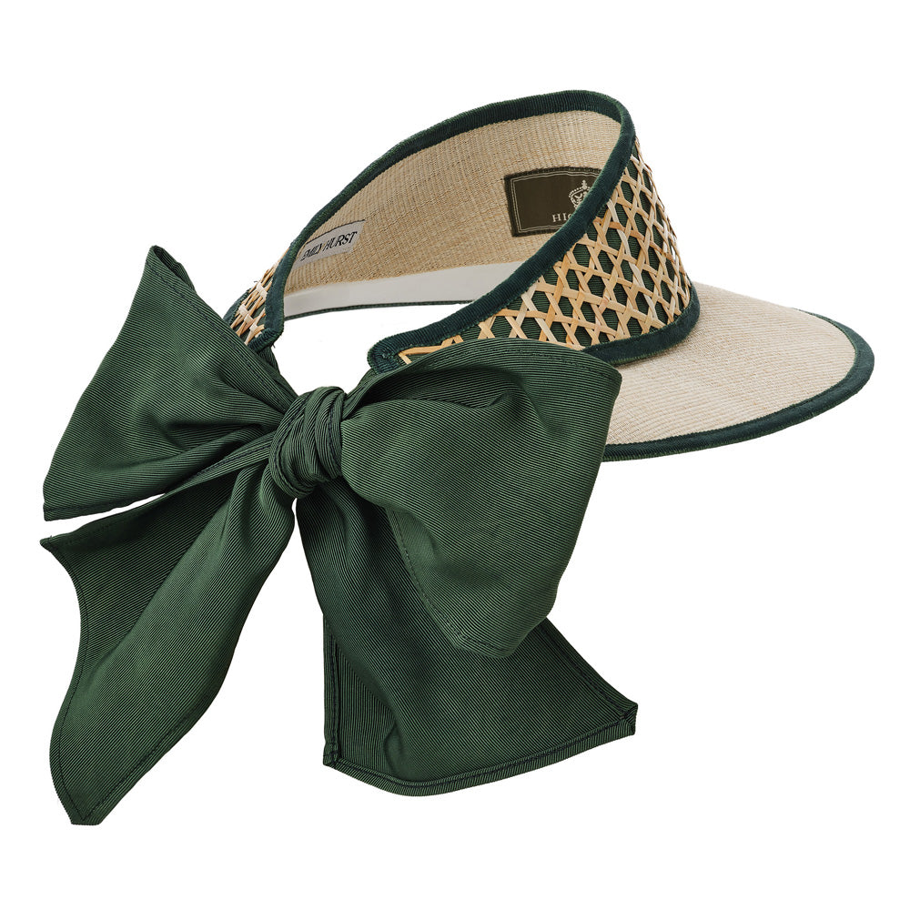 Visor with a large green bow and patterned interior on a white background