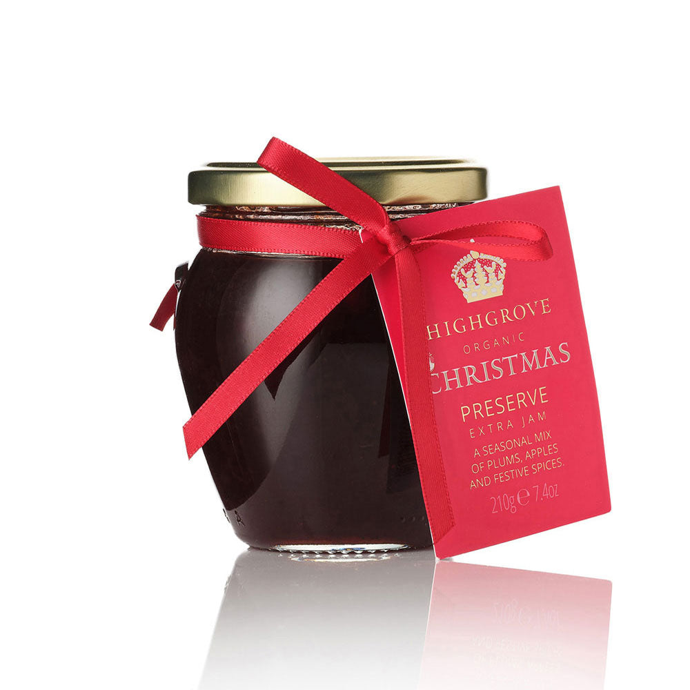 Jar of Highgrove Organic Christmas Preserve with a red ribbon and tag on a white background