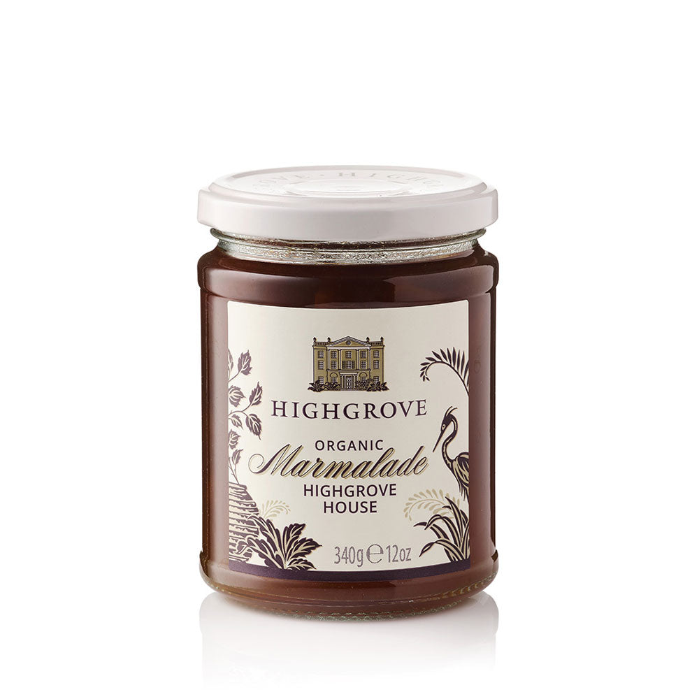 A glass jar of Highgrove Organic Marmalade with a white lid and a cream-colored label featuring black text and botanical illustrations, set against a plain white background.