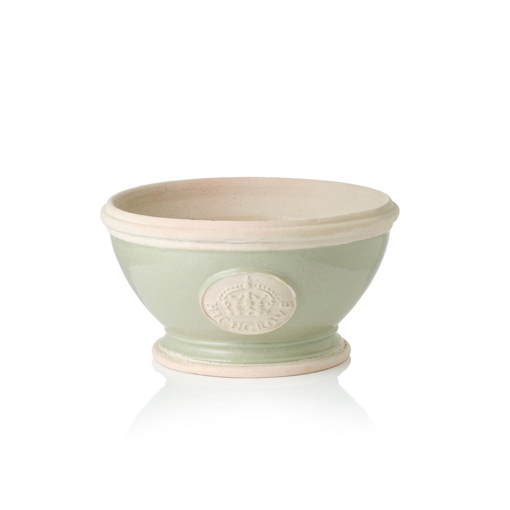 Green ceramic footed bowl plant pot with a beige rim and Highgrove logo on a white background
