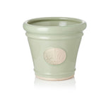 Green ceramic plant pot with a Highgrove crown logo on a white background