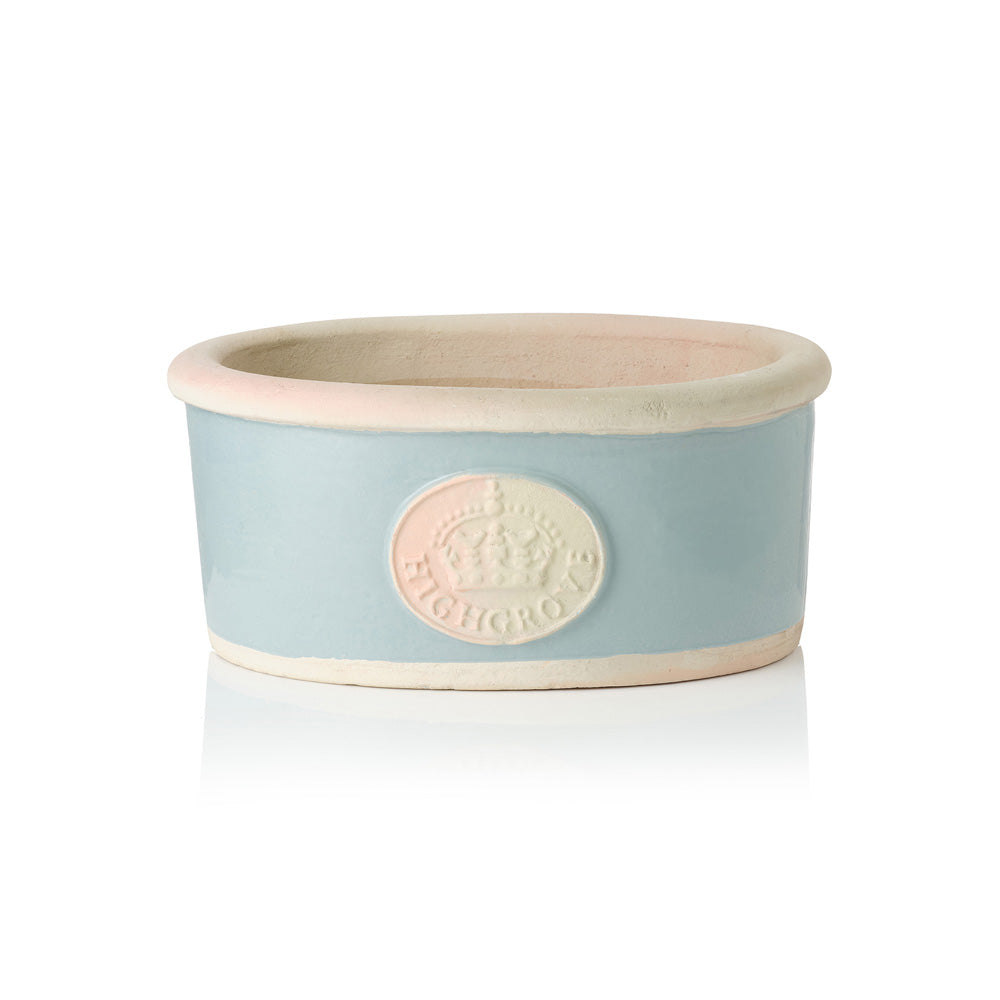 Scandi blue ceramic bowl plant pot with beige rim and Highgrove Crown logo on a white background