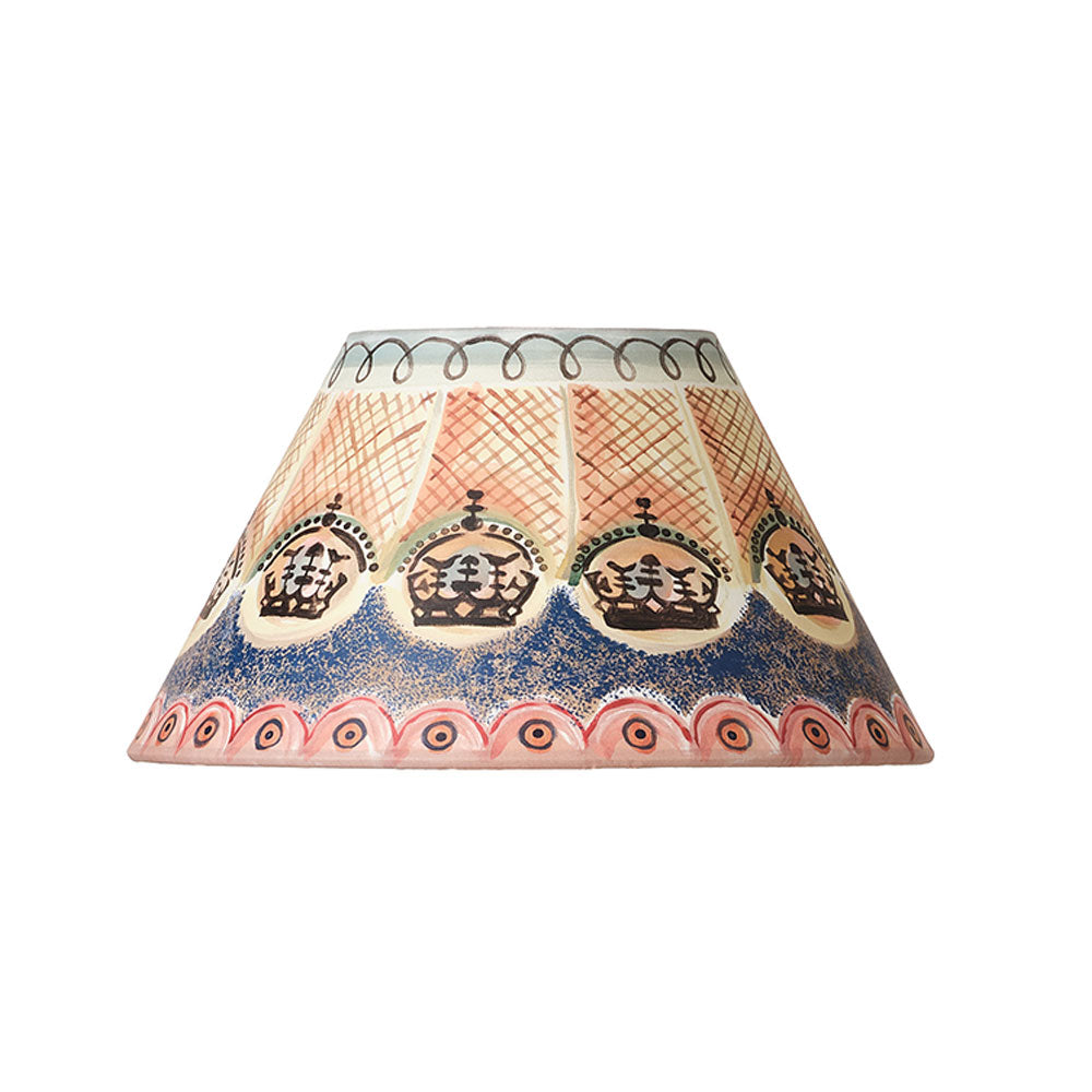 A decorative lampshade featuring a detailed hand-painted pattern with five crowns, a blue speckled wave design, and pink and gold lattice details on a white background.