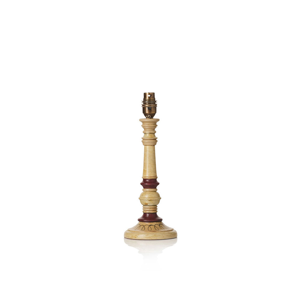 A vintage-style wooden table lamp base with a light beige body, dark reddish-brown painted accents, and a brass-colored metal socket at the top, shown on a plain white background.