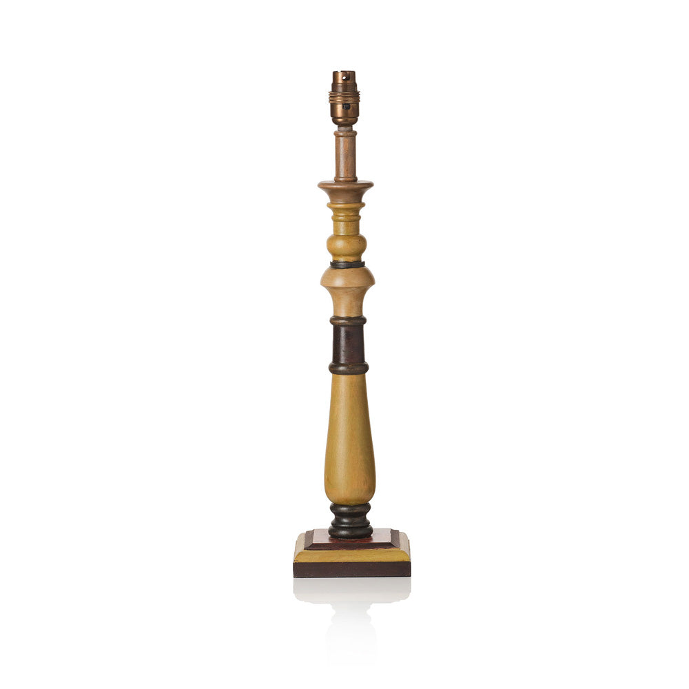 A vintage-style table lamp featuring a turned wood base in warm golden-brown and dark brown tones, with a matching brass-toned socket at the top, set against a plain white background.