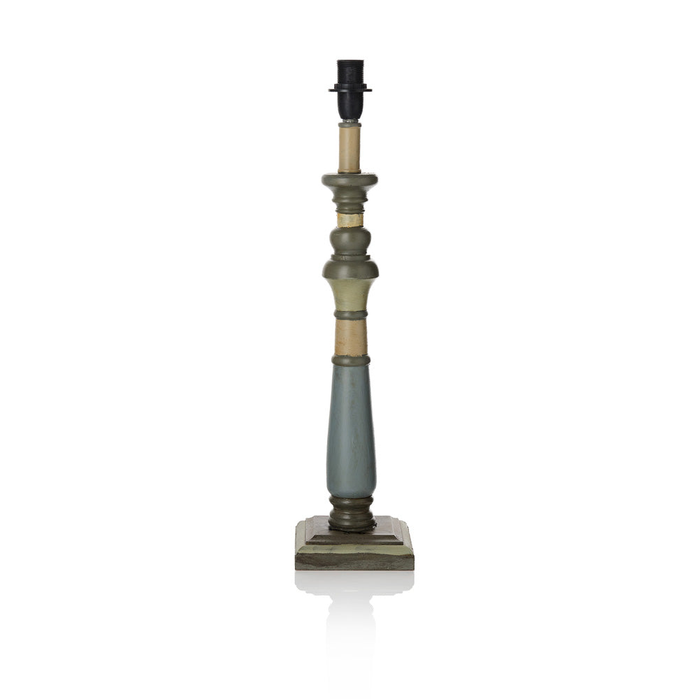Decorative lamp base with a rustic design on a white background