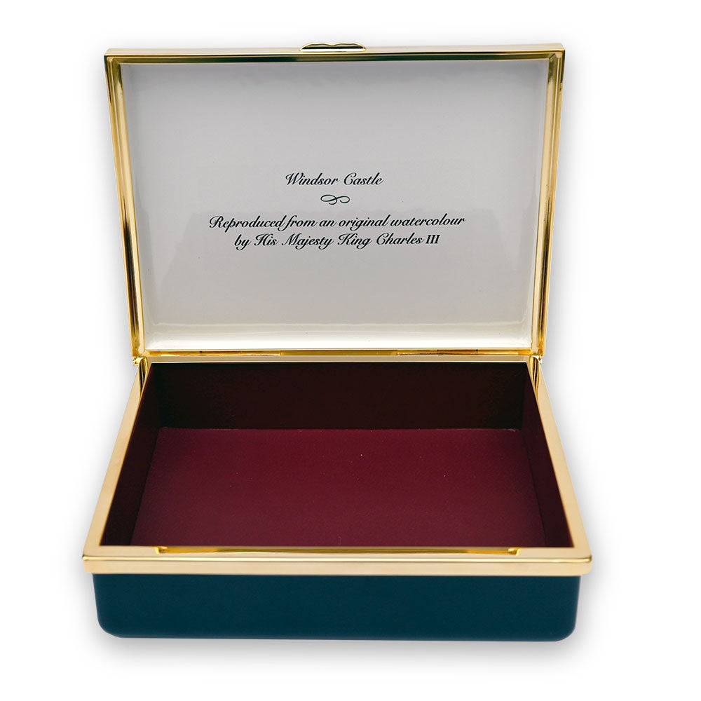 Decorative box with gold rim and red interior, featuring text about Windsor Castle.