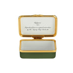 Inside of small enamel trinket box with writing that reads "Reproduced from an original watercolour by His Majesty King Charles III"
