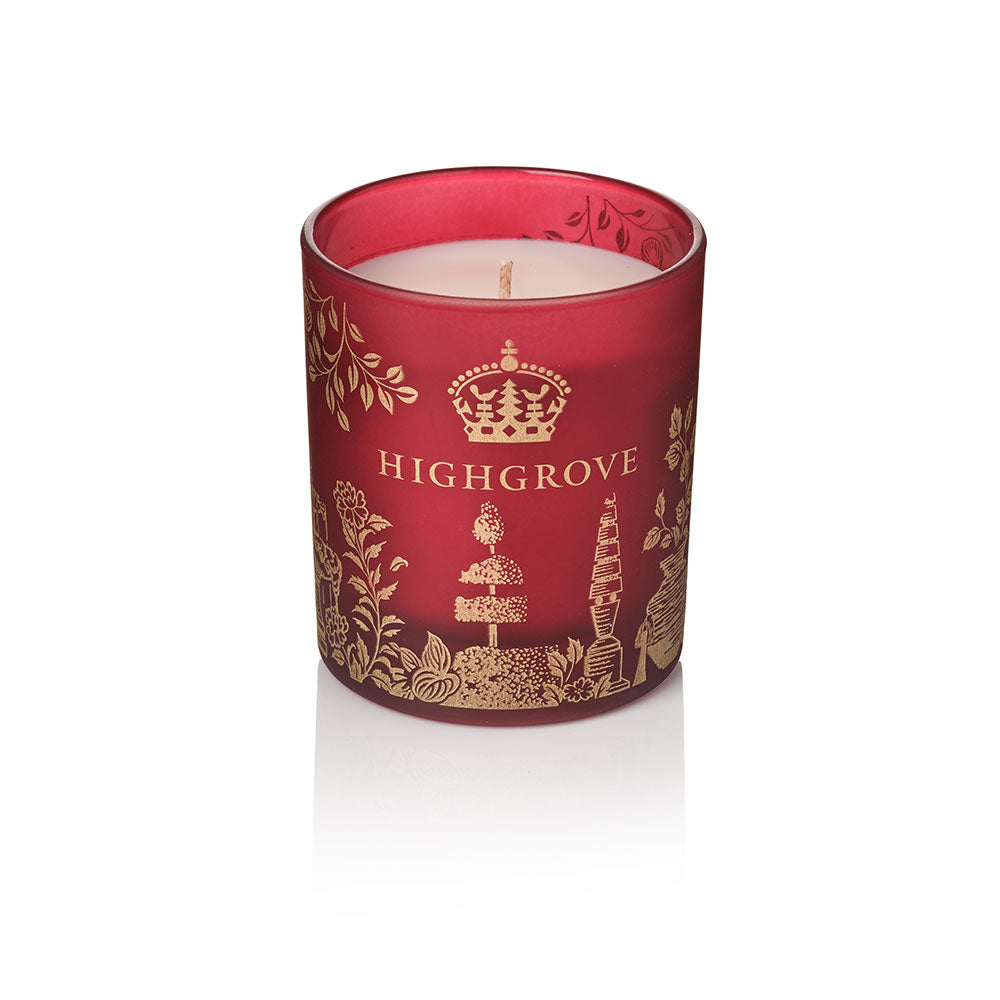 A red glass jar candle with gold illustrations and the brand name HIGHGROVE printed on the front, set against a clean white background.