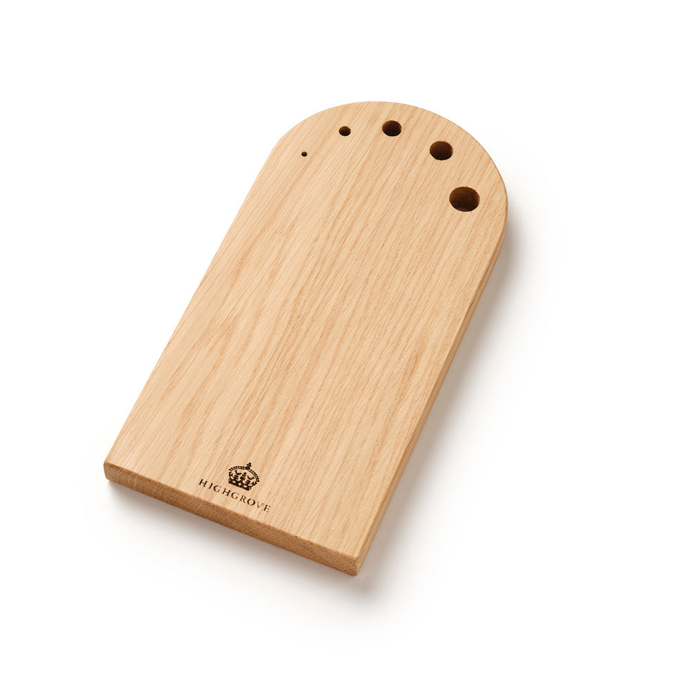 A light natural oak board with a rounded top and pre-drilled holes, featuring the Highgrove logo and text engraved near the bottom left, set against a clean white background.