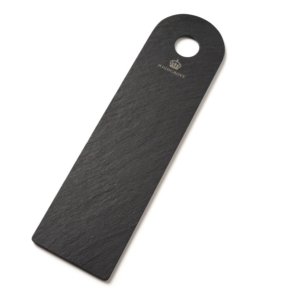 A black slate serving board with a rounded top and a hanging hole, featuring the Highgrove crown logo and text printed near the top, shown on a plain white background.