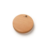 A round, light brown wooden board with a natural wood grain texture, featuring a small black crown logo and the brand name 'HIGHGROVE' printed near the top edge, set against a plain white background.