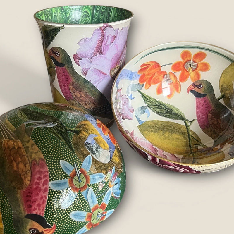Decorative ceramic items with bird and floral designs on a light background