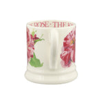 White mug with floral design and text on a white background