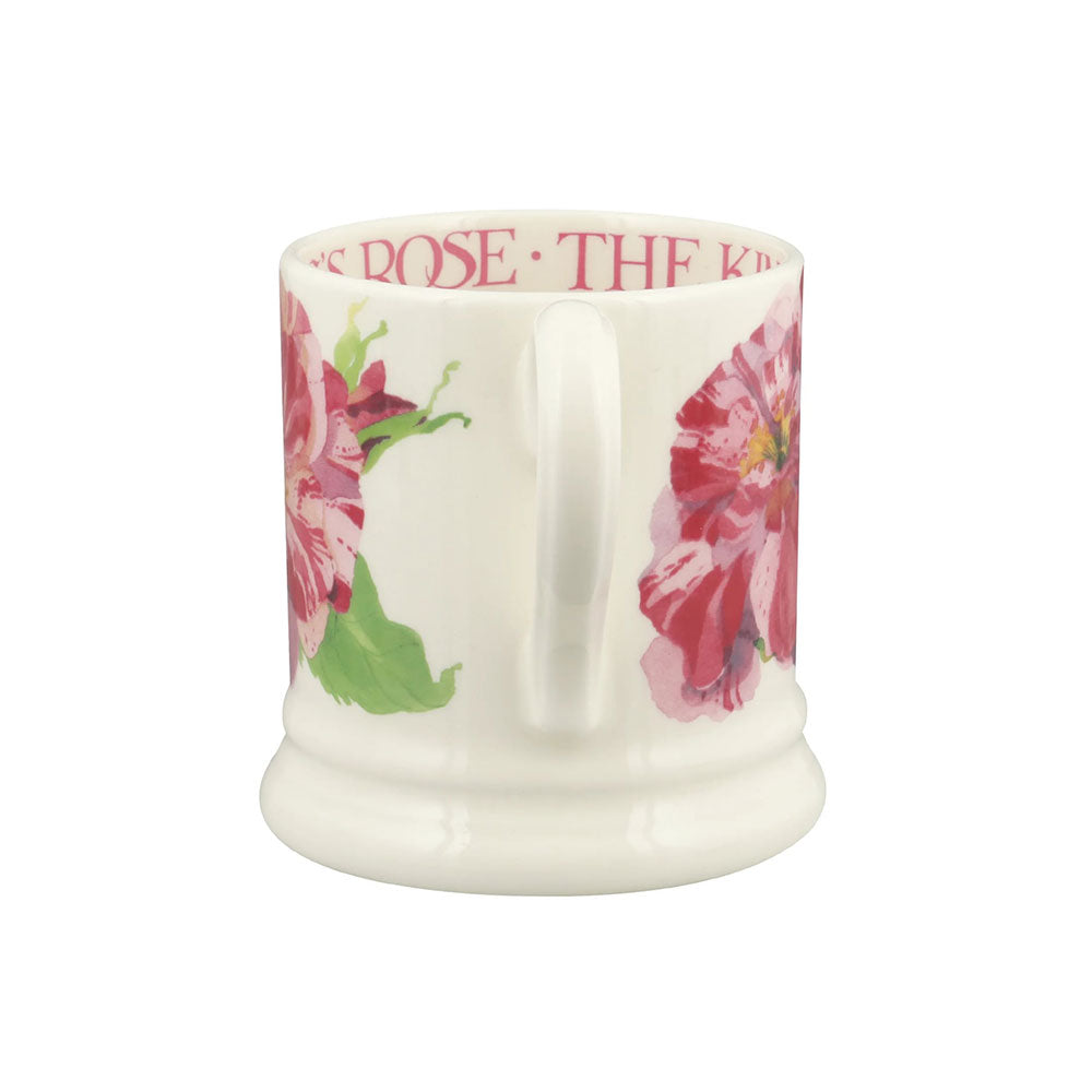 White mug with floral design and text on a white background