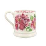 Floral mug with 'The King's Rose' branding on a white background