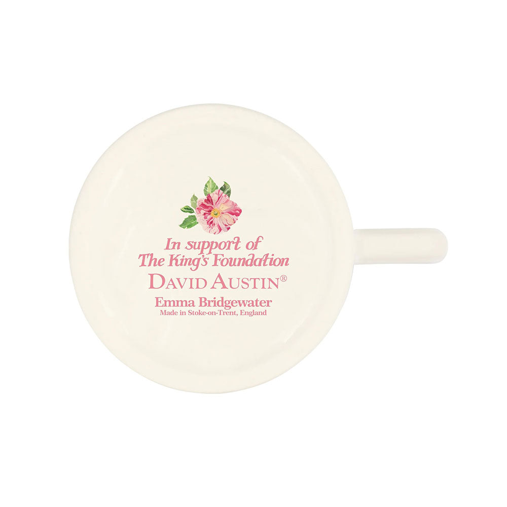 White mug with floral design and text on a white background