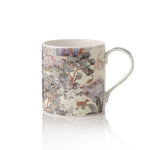Mug with Stumpery nature-themed design on a white background
