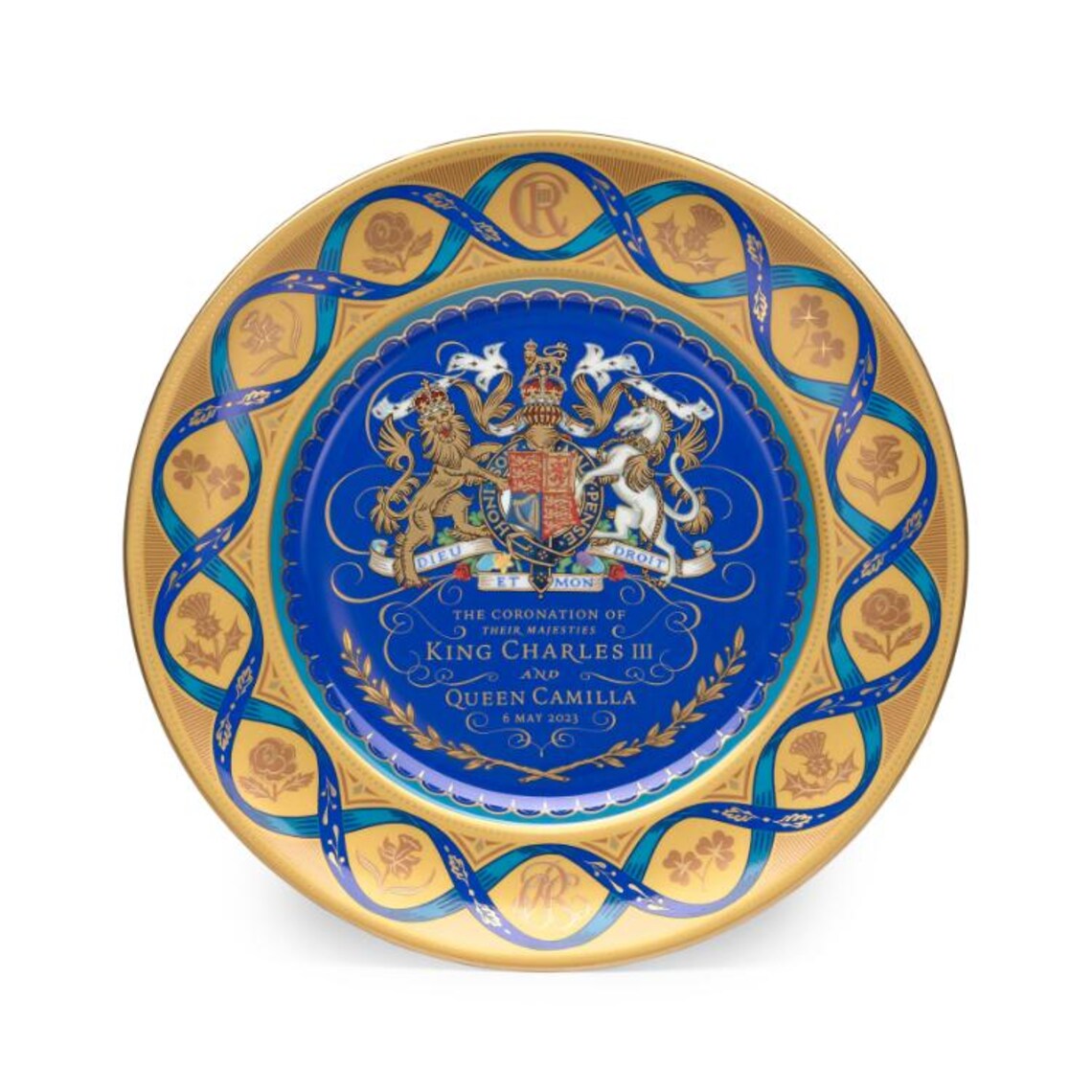 Decorative plate with royal crest and text on a white background