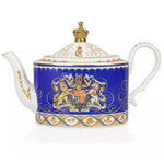 Decorative teapot with royal crest and gold accents on a white background