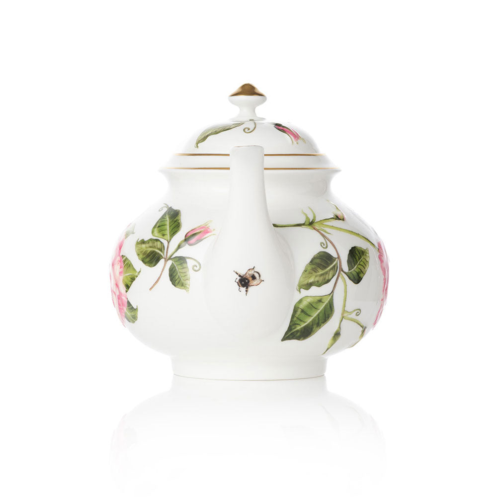 Teapot with The King's Rose floral and insect bee design on a white background