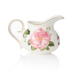 White ceramic creamer jug with The King's Rose floral design on a white background