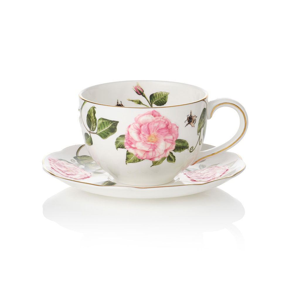 Teacup and saucer with The King's Rose floral design on a white background