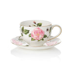 Teacup and saucer with The King's Rose floral design on a white background