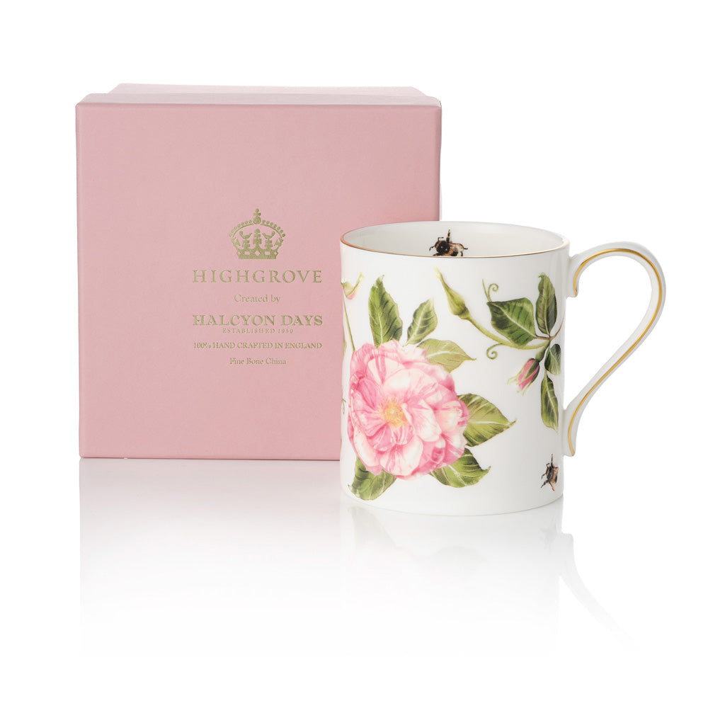 The King's Rose floral mug next to a matching pink box with gold 'Highgrove' writing on a white background