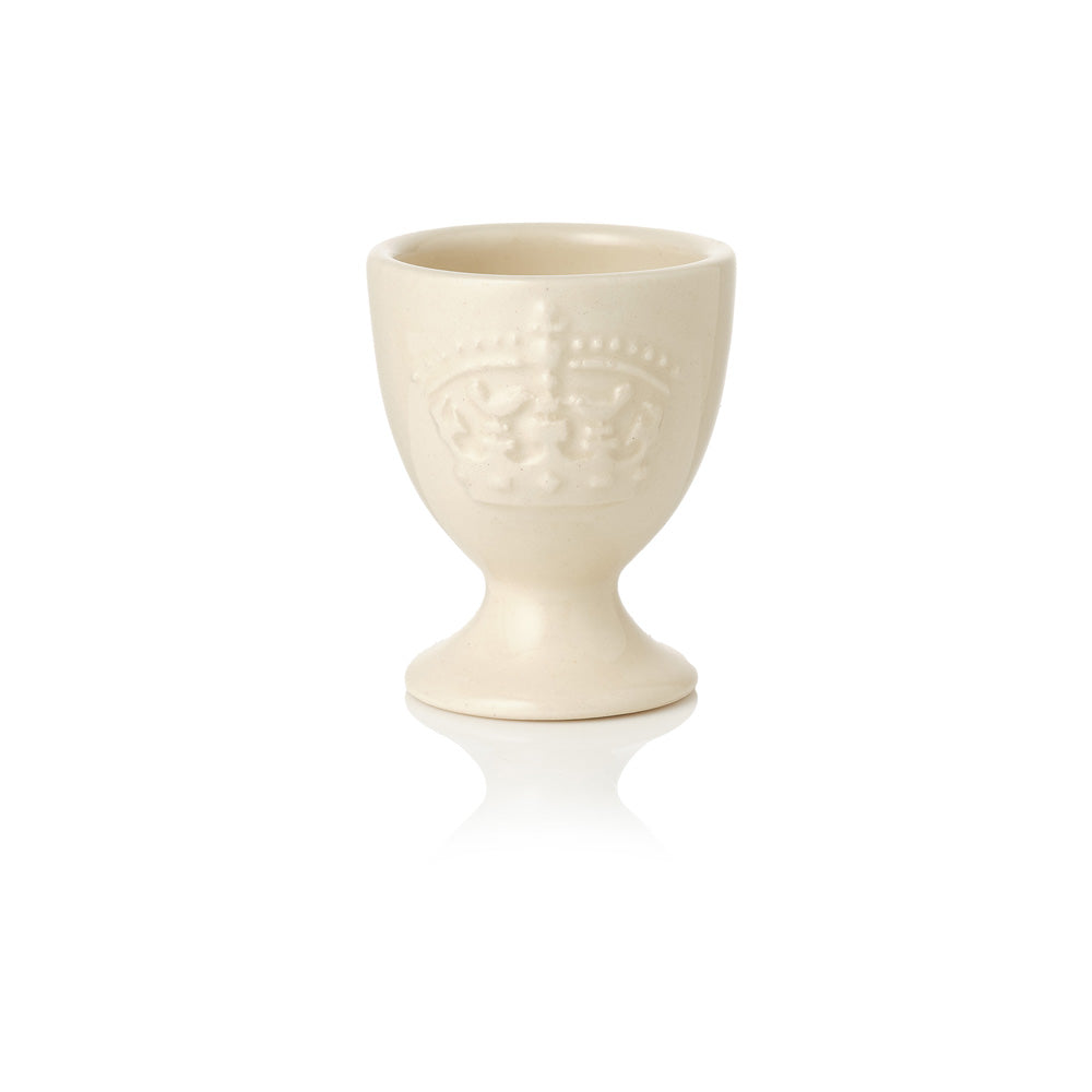 Cream-coloured ceramic egg cup with Highgrove crown on a white background