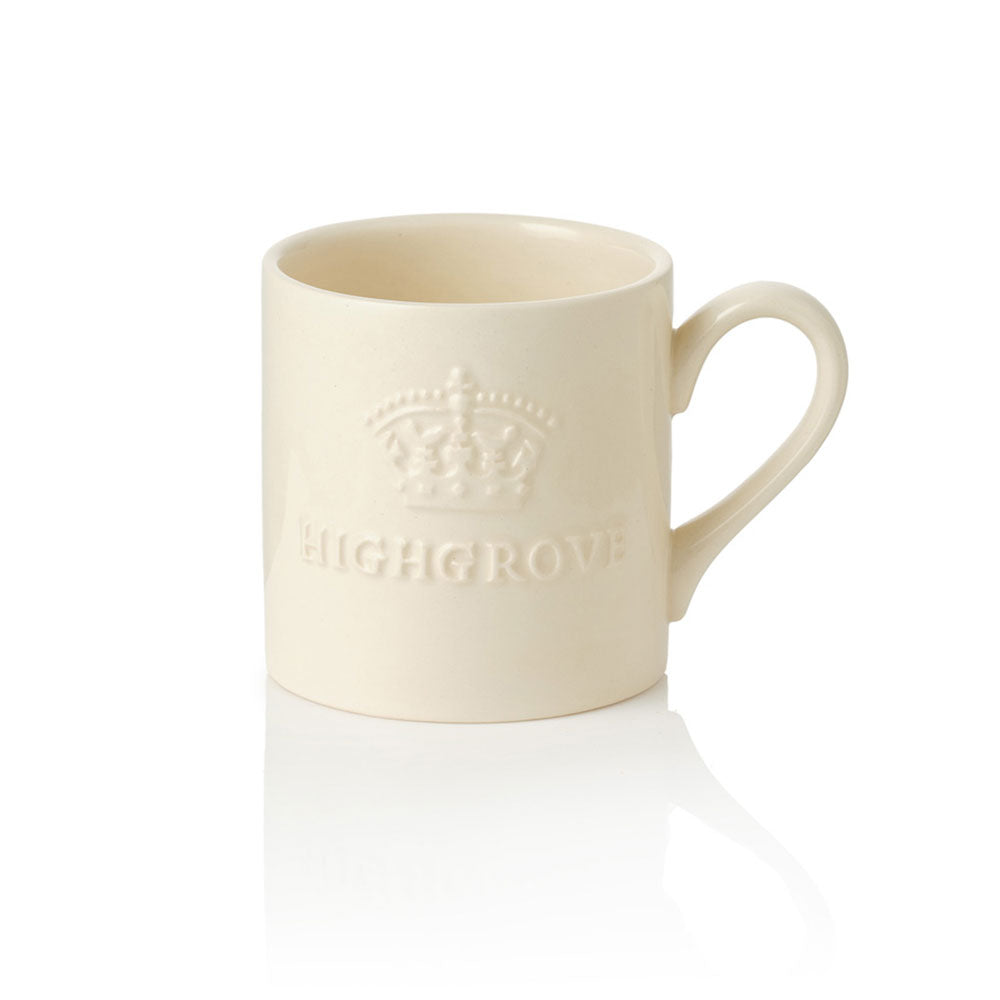 Cream-coloured ceramic mug with 'Highgrove' branding on a white background