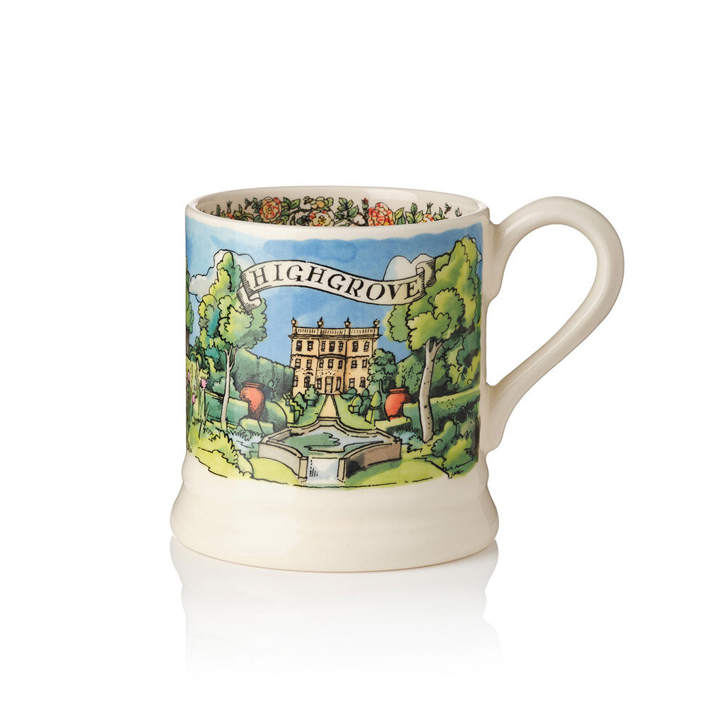 An off-white ceramic mug featuring a colourful printed illustration of Highgrove Garden features labelled 'HIGHGROVE' with trees, Highgrove House and the Lily Pool Garden.