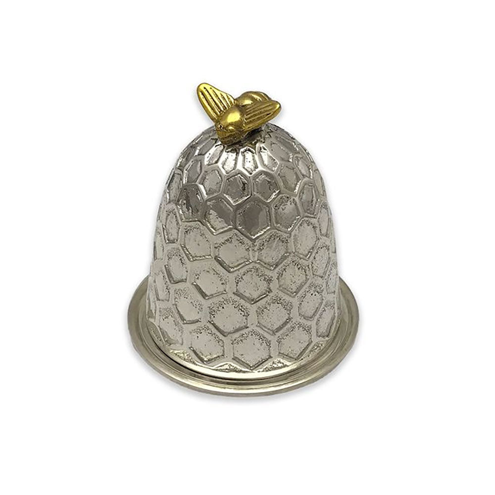 A silver bell-shaped thimble with a honeycomb pattern, featuring a small gold bee ornament on top and a circular gold ring at the base, set against a plain white background.