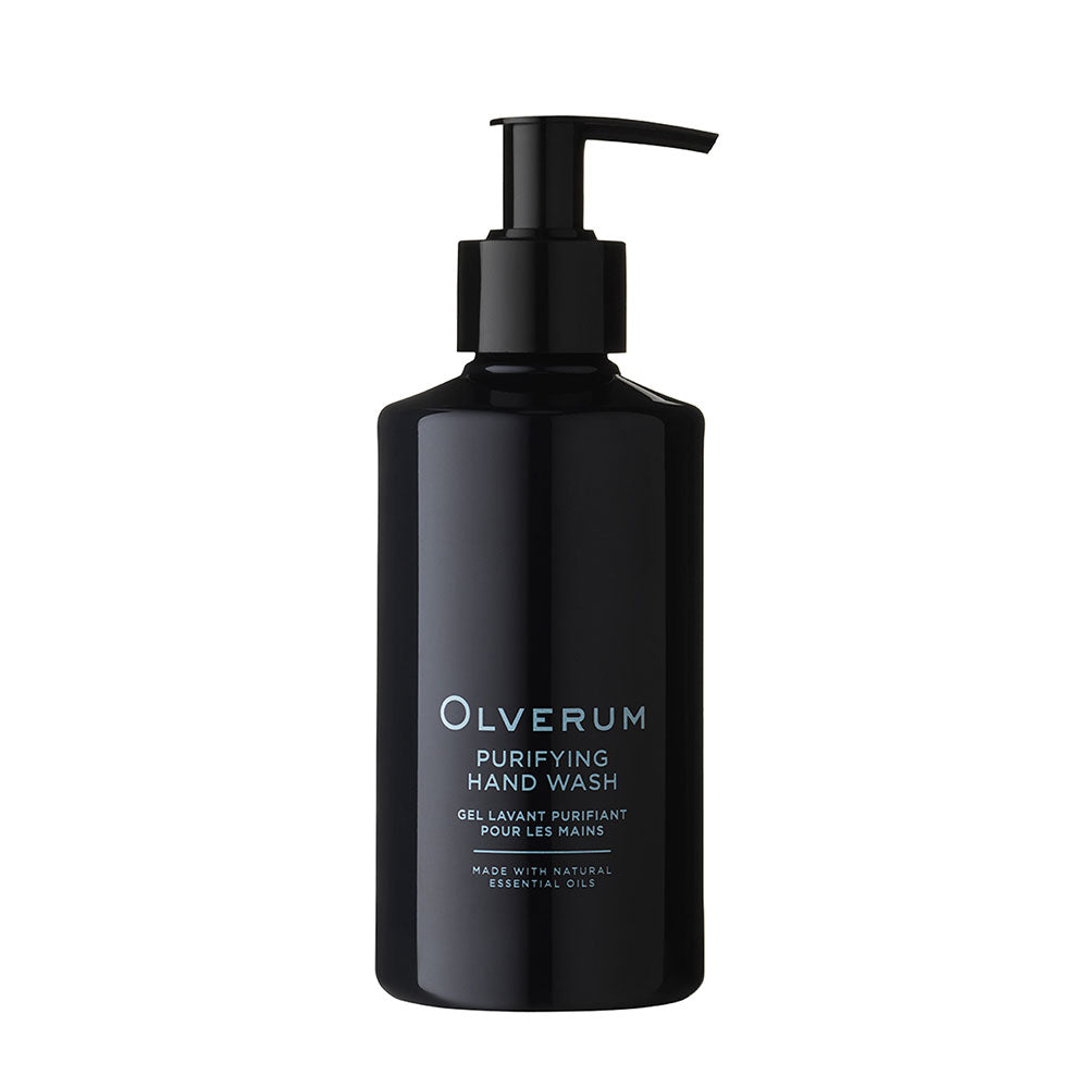 Black bottle of Olverum body cleanser on a white background
