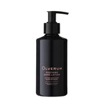 Black bottle of Olverum soothing hand lotion on a white background