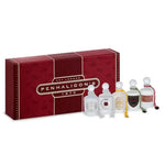 Penhaligon's Est. London 1870 gift set featuring a textured dark red box with gold lettering, alongside five miniature clear glass perfume bottles with white caps and colorful labels.