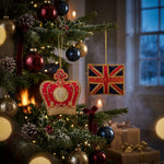 Festive Christmas tree with red, gold and blue ornaments, featuring a crown-shaped “ROYAL GROVE” bauble and a Union Jack “GOD SAVE THE KING” decoration, promoting Highgrove Christmas Lunch.