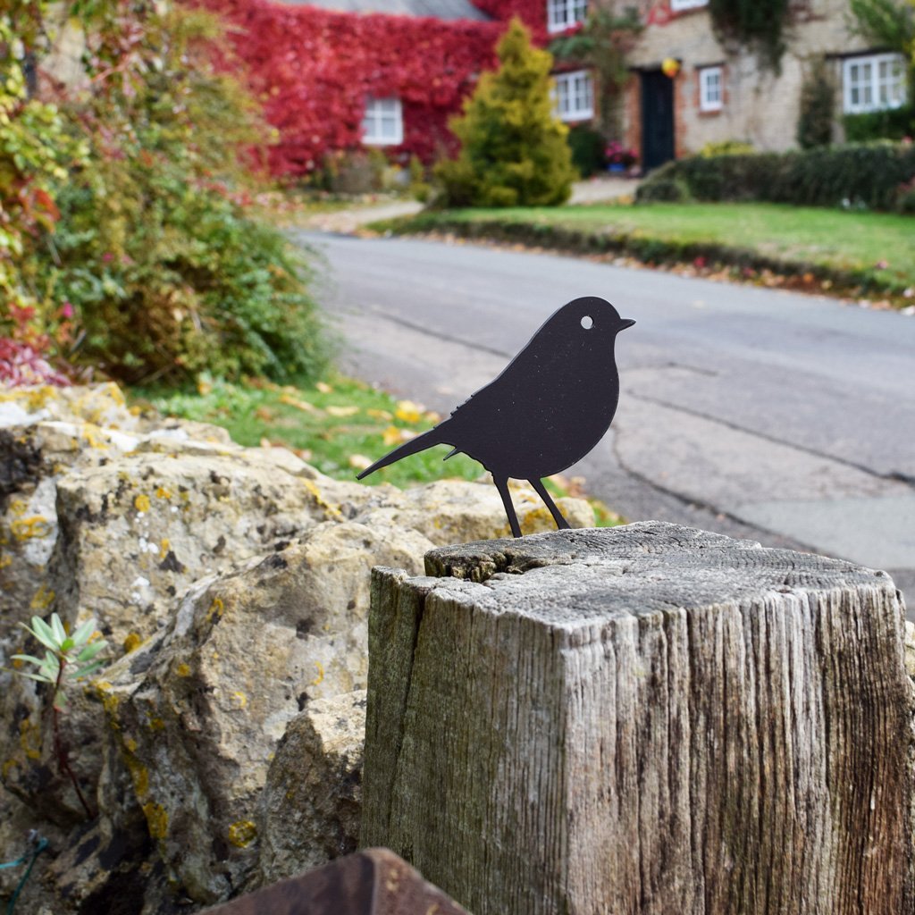 Robin decoration on fence post